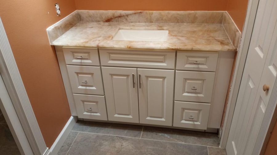 Warm natural stone vanity for residential bathroom remodeling