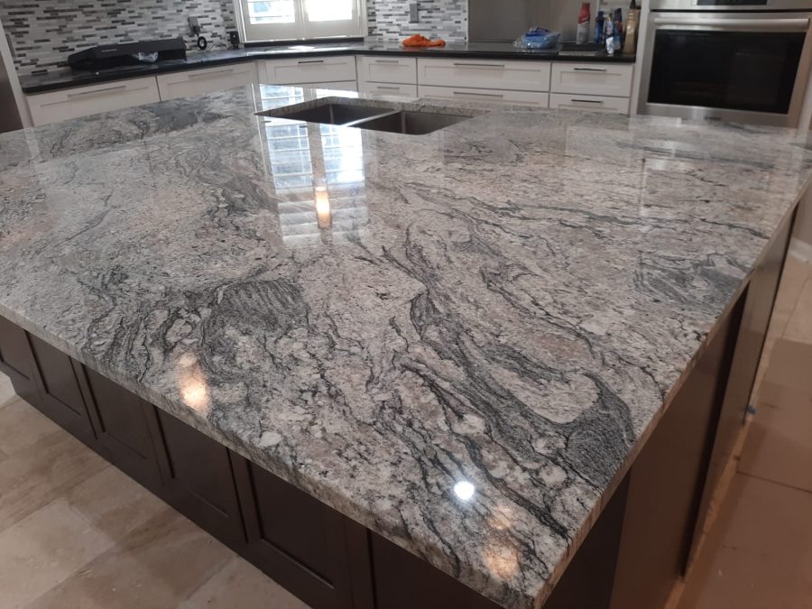 Granite kitchen island installation for luxury remodeling in Florida