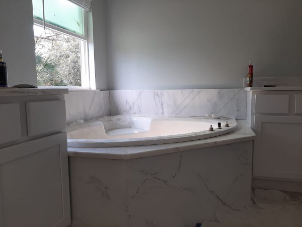 Custom marble tub surround in a Florida bathroom remodel