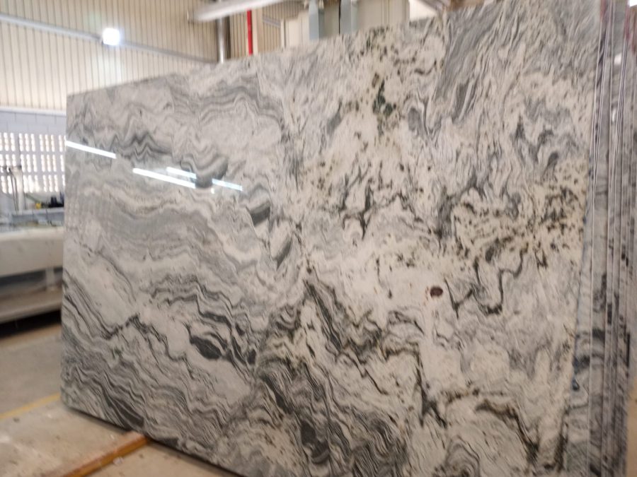 Natural stone slab with dramatic black and white movement