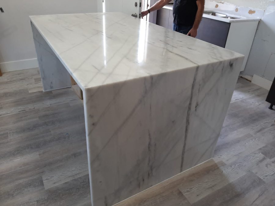 White quartz waterfall counter for modern kitchen remodeling