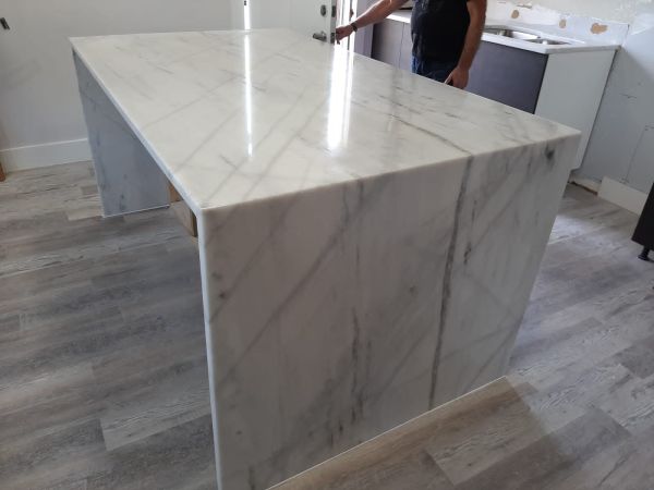 Finished quartz island installation for residential remodeling